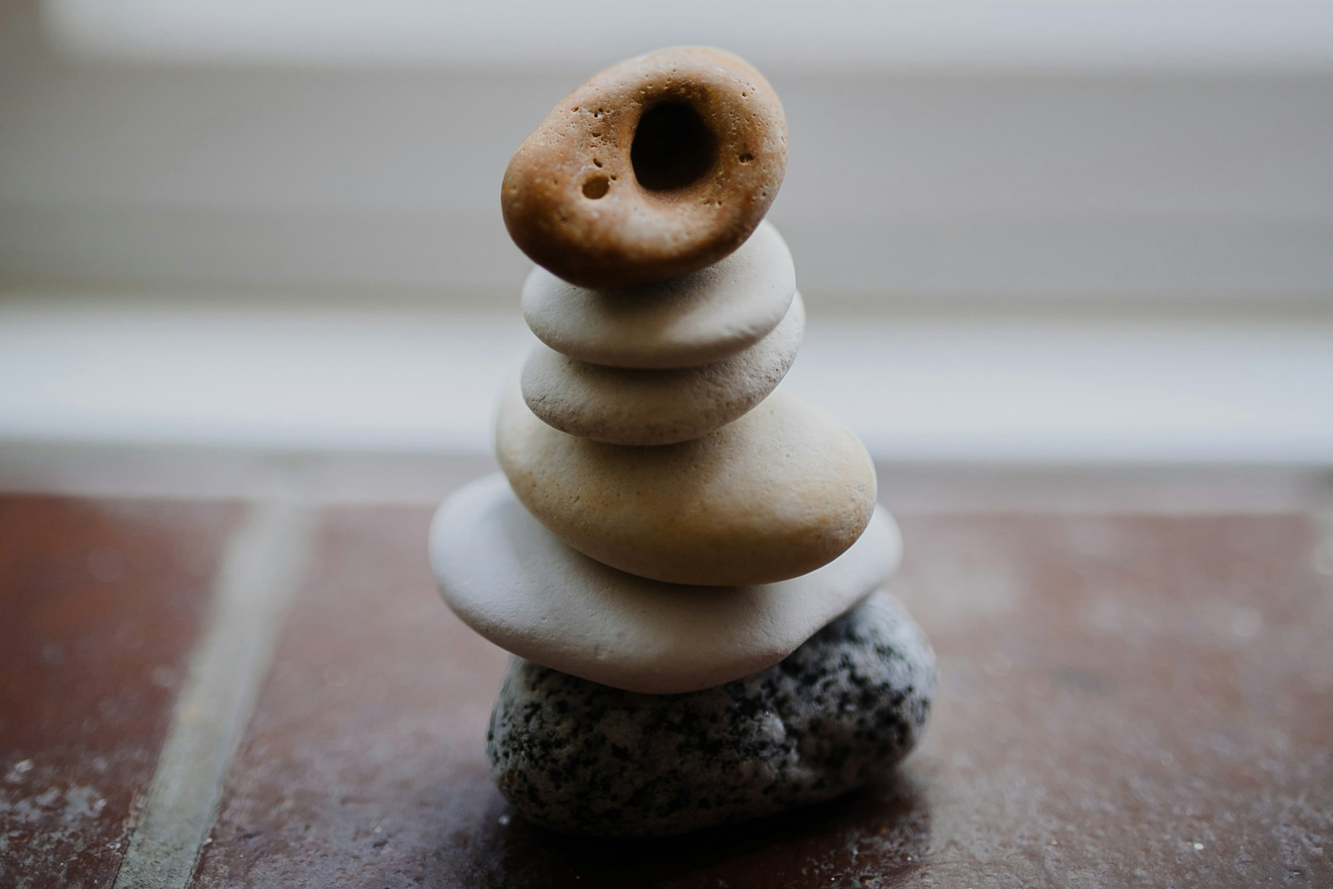 Small stacked stones in a windowsill